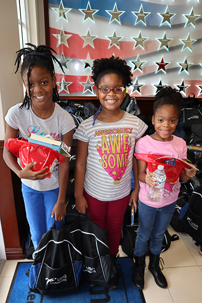 ►United Way of Broward County’s Mission United teamed up with The Castle Group to distribute 525 backpacks filled with school supplies to children of local military families.