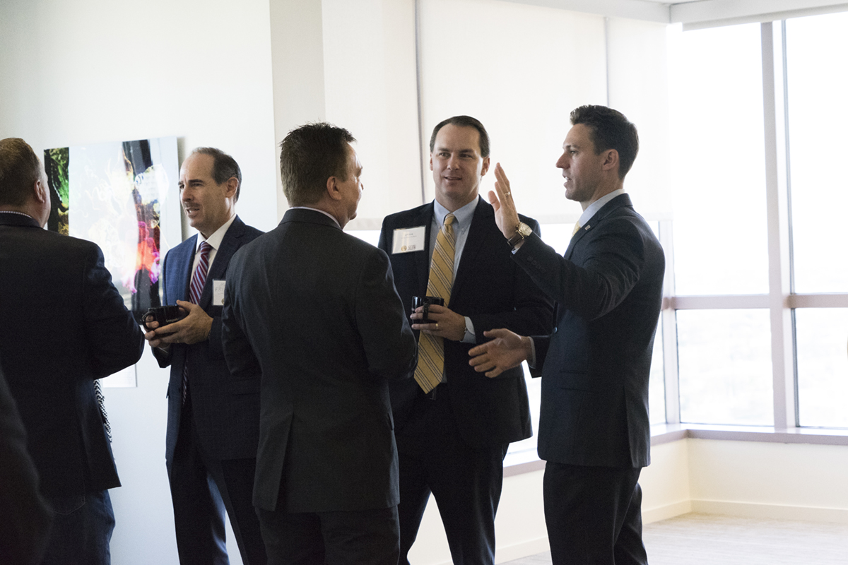 Attendees enjoy networking before the start of the roundtable