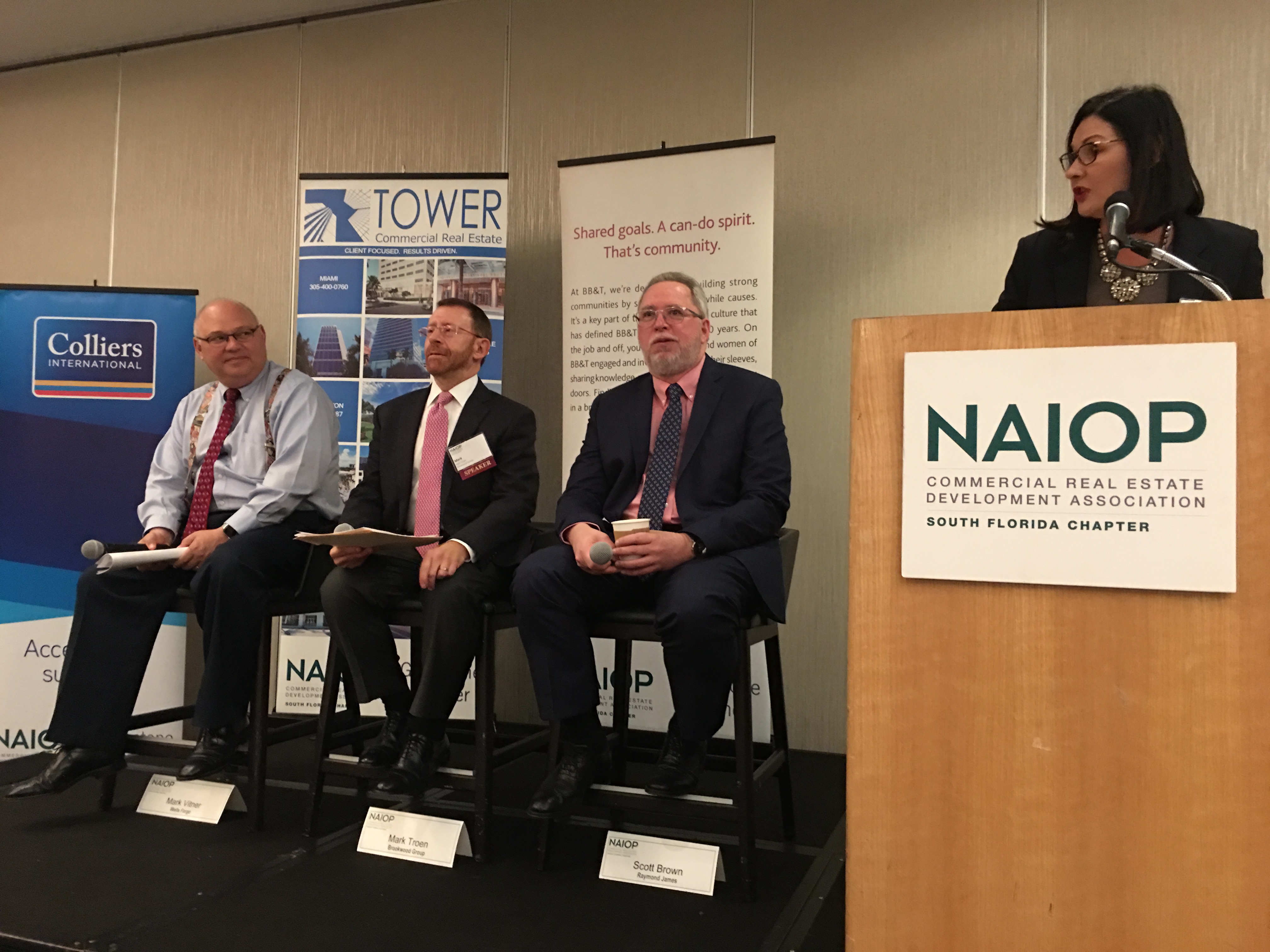 NAIOP Panelists Mark Vitner, Mark Troen and Scott Brown with NAIOP President and moderator Darcie Lunsford