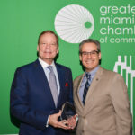 W. Allen Morris, chairman, president and CEO of The Allen Morris Co. receives a lifetime achievement award from Greater Miami Chamber of Commerce President and CEO Alfred Sanchez