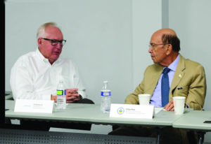 Ted Berglund, president and CEO of Dyplast Products, speaks with U.S. Commerce Secretary Wilbur Ross