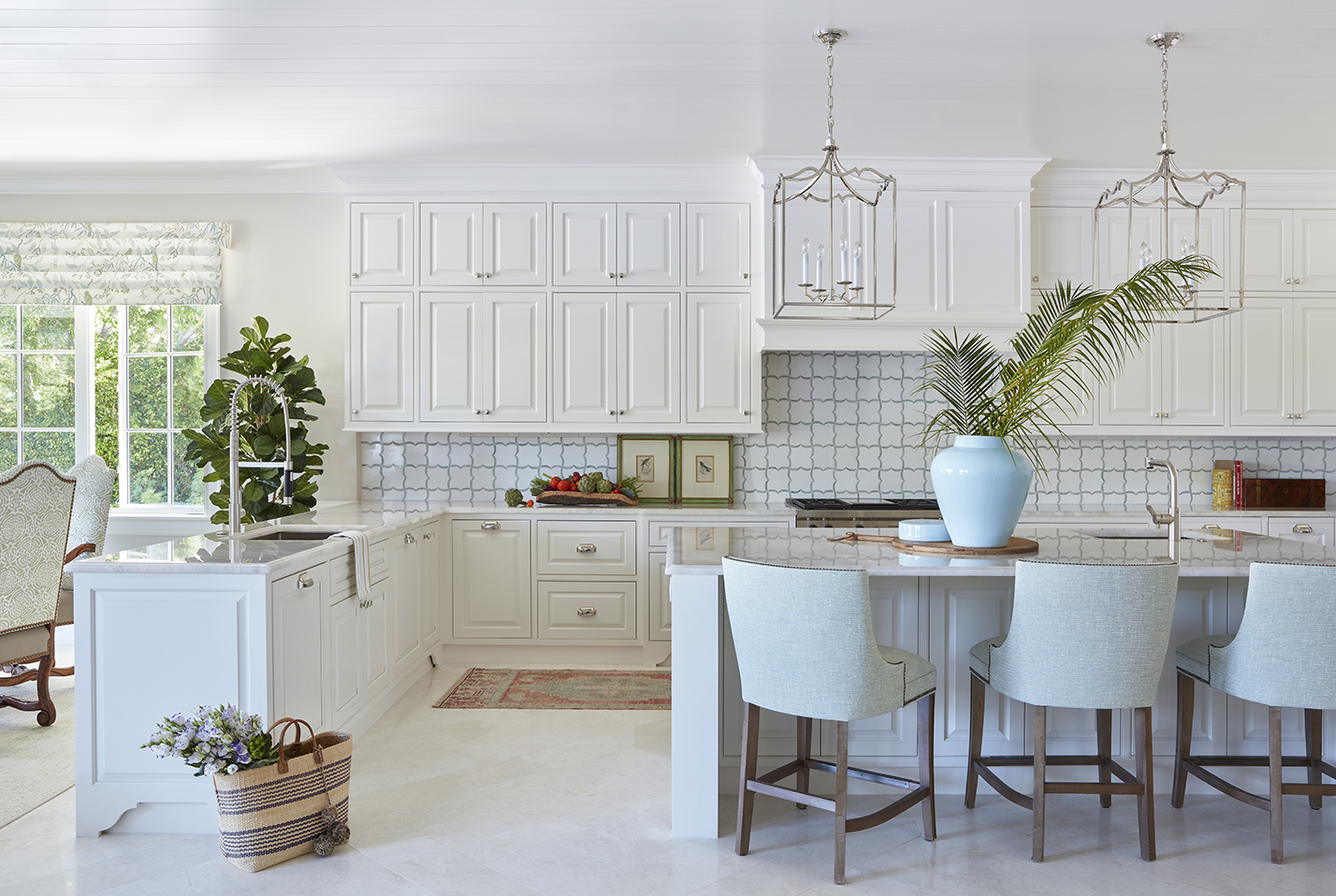 The kitchen’s quartzite-topped island is paired with stools covered in performance fabric.