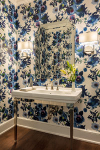 A bold floral powder room enlivens a Jupiter home.